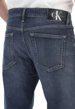 Jeans Calvin Klein Jeans Uomo Lavaggio Scuro Slim Taper -Negozio Da Uomo Alla Moda 2b201dda92576790ab0da8189f2a3a3a